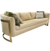 modern curved sofa with brass legs