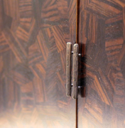 Detail of bronze pull hardware and close up of Macassar parquetry