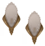 Art Deco Glass sconces with brass bas relief hardware.