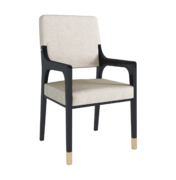 The Aspen dining chair with arms features a dark lacquer frame and smoked brass details.