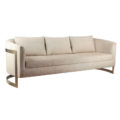 Curved sofa with brass legs