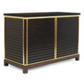 Modern 2 door cabinet in wood with brass trim and stone top