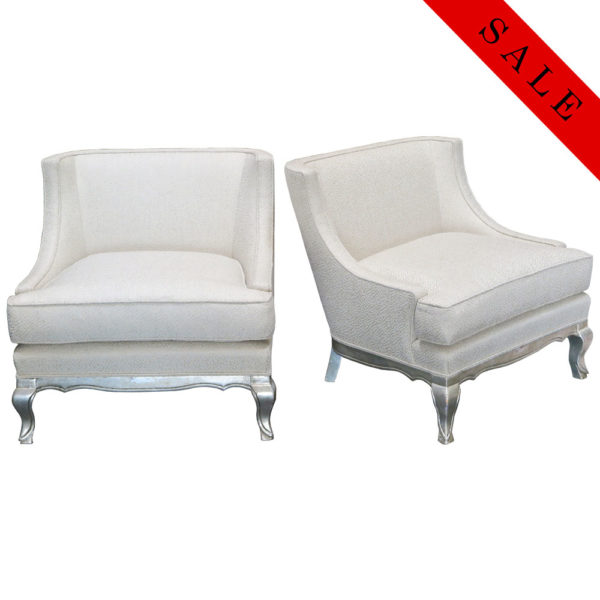 Vintage pair of white chairs with silver leaf feet